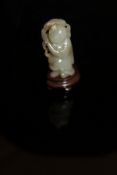 A Chinese carved jade figure of Caishen on a carved hardwood base CONDITION REPORTS