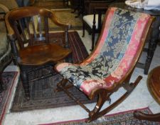 A Victorian walnut framed rocking chair with turned and ringed front supports and red,