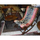 A Victorian walnut framed rocking chair with turned and ringed front supports and red,