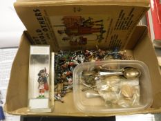 A box containing a collection of silver and silver plated teaspoons,