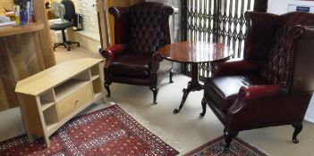 A pair of modern Thomas Lloyd upholstered wing back scroll arm chairs on cabriole legs in the