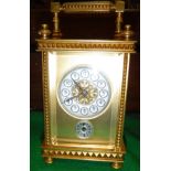 A brass cased carriage alarm clock,