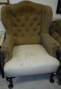 A circa 1900 upholstered wing back scroll arm chair in the George III taste raised on cabriole legs