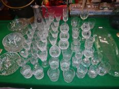 A quantity of various cut glassware including fruit bowls, claret jug,
