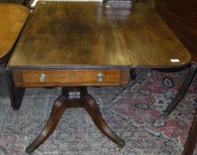 A 19th Century mahogany drop-leaf pembroke table with single drawer to the top on turned and carved