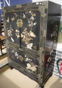 A Chinese lacquered side cabinet with mother of pearl and inlaid decoration in the Shibayama manner,
