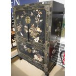 A Chinese lacquered side cabinet with mother of pearl and inlaid decoration in the Shibayama manner,