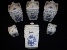 A set of four Berta blue and white and glazed pottery jars and covers inscribed "Gries", "Brösel",