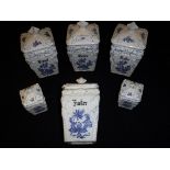 A set of four Berta blue and white and glazed pottery jars and covers inscribed "Gries", "Brösel",