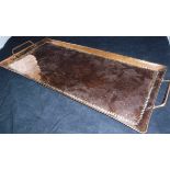 A Newylyn School rectangular beaten copper tray, stamped to base "J.