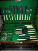 An oak cased canteen of plated cutlery and four boxes of sundries to include treen ware,