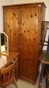 A modern pine four drawer dwarf cupboard, set of six panel seated slat back dining chairs,