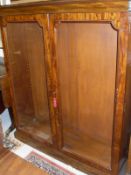 A Victorian mahogany two door glazed bookcase cabinet with adjustable shelving on a plinth base