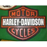 A collection of four reproduction painted cast iron signs "Royal Enfield", "Norton",