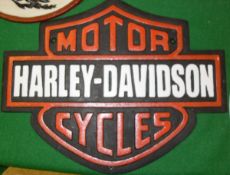 A collection of four reproduction painted cast iron signs "Royal Enfield", "Norton",