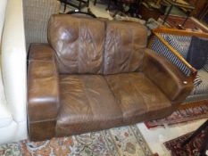A modern brown leather two seat sofa