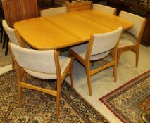 A Skovby 1980's dining room suite comprising extending dining table,