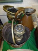 A brass fireside companion set, copper coal helmet, brass coal helmet, two gallon haystack measure,