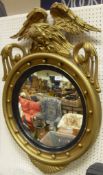 A 19th Century gilt framed convex circular wall mirror, the top surmounted by an eagle,
