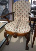 A late 19th Century oak elbow chair in the Irish manner,