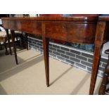 A 19th Century mahogany serving table, the single piece shallow bow fronted top over three drawers,