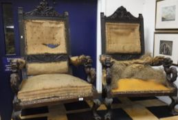 A pair of Victorian carved oak throne chairs in the gothic revival taste (for re-upholstery)