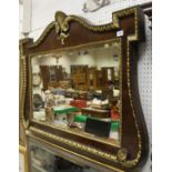 A mahogany and gesso decorated wall mirror in the George II style, the shaped top with shell,