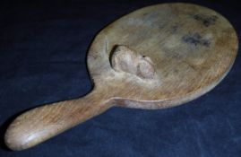A mid 20th Century oak cheese board by Robert Thompson of Kilburn (The Mouseman) with raised mouse