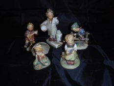 A collection of four Goebel Hummel figures,