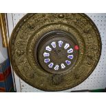 A brass wall clock,