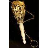 A 19th Century Continental gilt metal posy holder of entwined ivy design with turned mother of