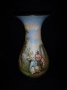 A French Pottery baluster shaped vase with painted decoration of a courting couple