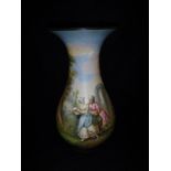 A French Pottery baluster shaped vase with painted decoration of a courting couple