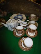 A New Hall silver shaped pottery teapot, a set of six New Hall style cups and saucers and cream jug,