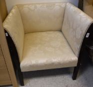 A Regency style square upholstered tub chair with moulded show frame on moulded supports and a 19th