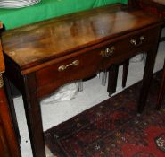 A mahogany fold-over tea table in the George III taste with single drawer on square chamfered and