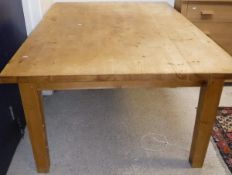 A modern pine farmhouse style kitchen table on square tapering legs