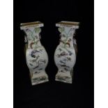 A pair of circa 1900 Meiji period Japanese satsuma ware vases of square baluster form decorated