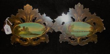 A pair of Victorian papier maché lacquered and painted face screens,