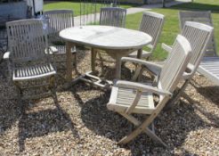 A modern Lindsey International teak garden furniture set comprising extending table and six chairs