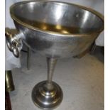 A floor-standing cast metal champagne cooler*