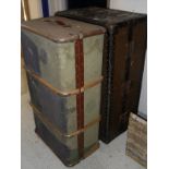 A vintage travel trunk with fitted hanging space and drawers,