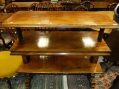 A Victorian three tier rise and fall buffet table of rectangular form with moulded edge,