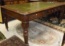 A mahogany library table in the Victorian manner,