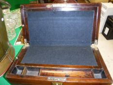 A Victorian mahogany writing slope with fitted interior