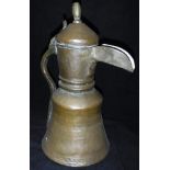 A late 18th / early 19th Century Middle Eastern brass and copper coffee pot with turned brass