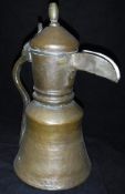 A late 18th / early 19th Century Middle Eastern brass and copper coffee pot with turned brass