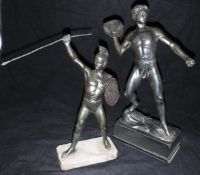 A bronzed figure of a man throwing a rock and a bronzed figure of a Greek warrior