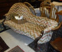 A Victorian chaise longue with shaped back and show front frame,