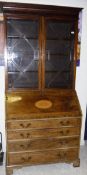 A Regency mahogany and rosewood cross-banded bureau bookcase,